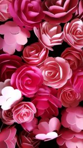 A striking arrangement of pink paper roses, perfect for floral-themed designs and backgrounds.